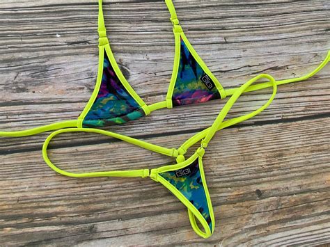 micro bikini am strand|Micro bikinis barely cover nipples, butt cracks at Miami Swim。